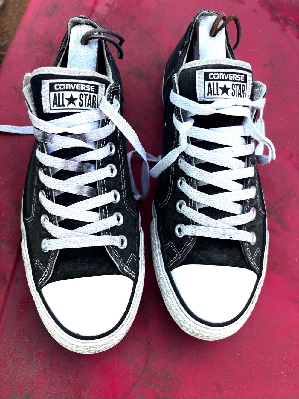 Black Converse All Star sneakers with white rubber toe cap and sole, size Men 10